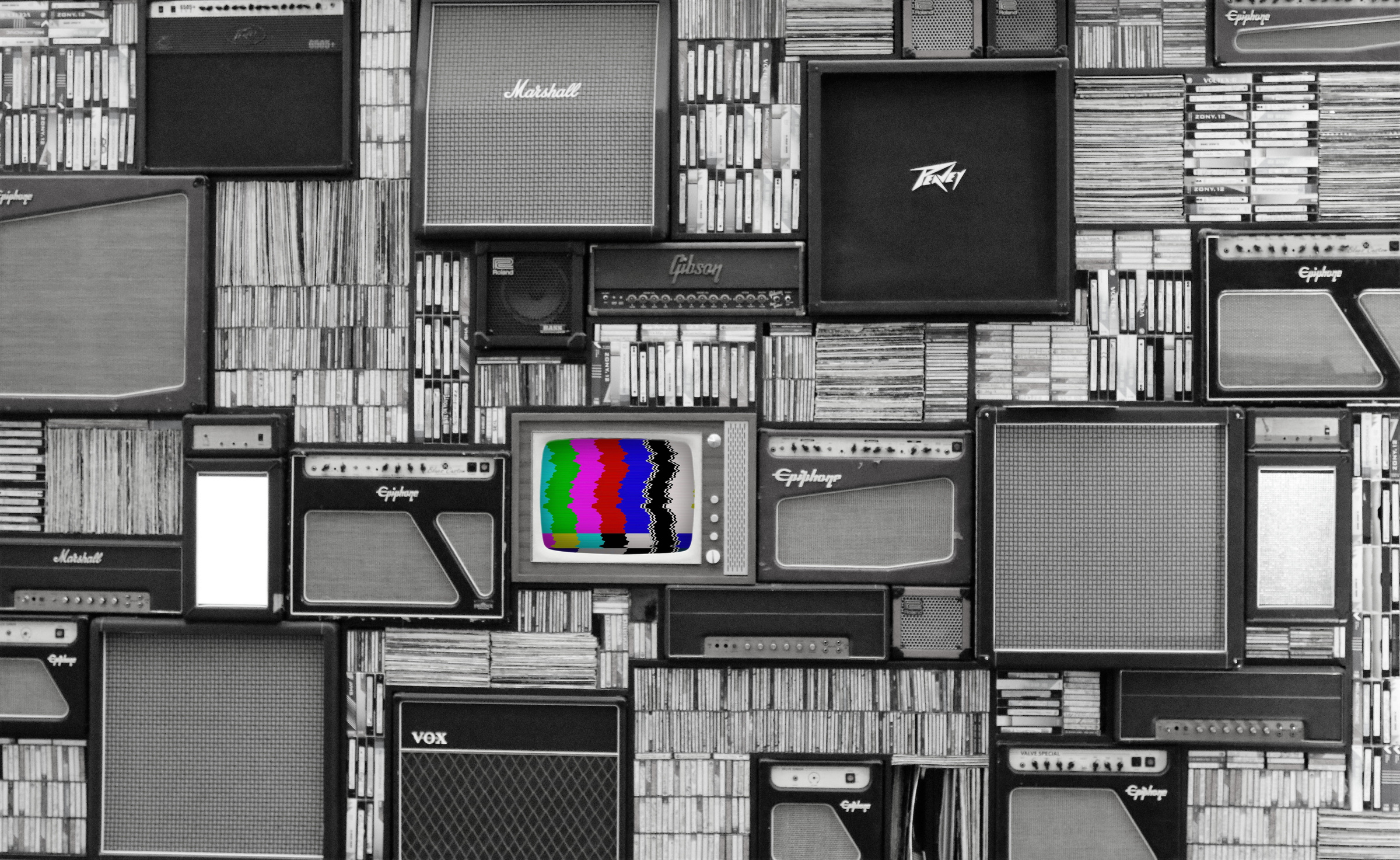 Wall Of Black And White Speakers With Colorful Television